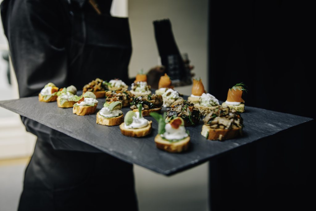Elegant Selection of Canapés on a Slate Serving Tray